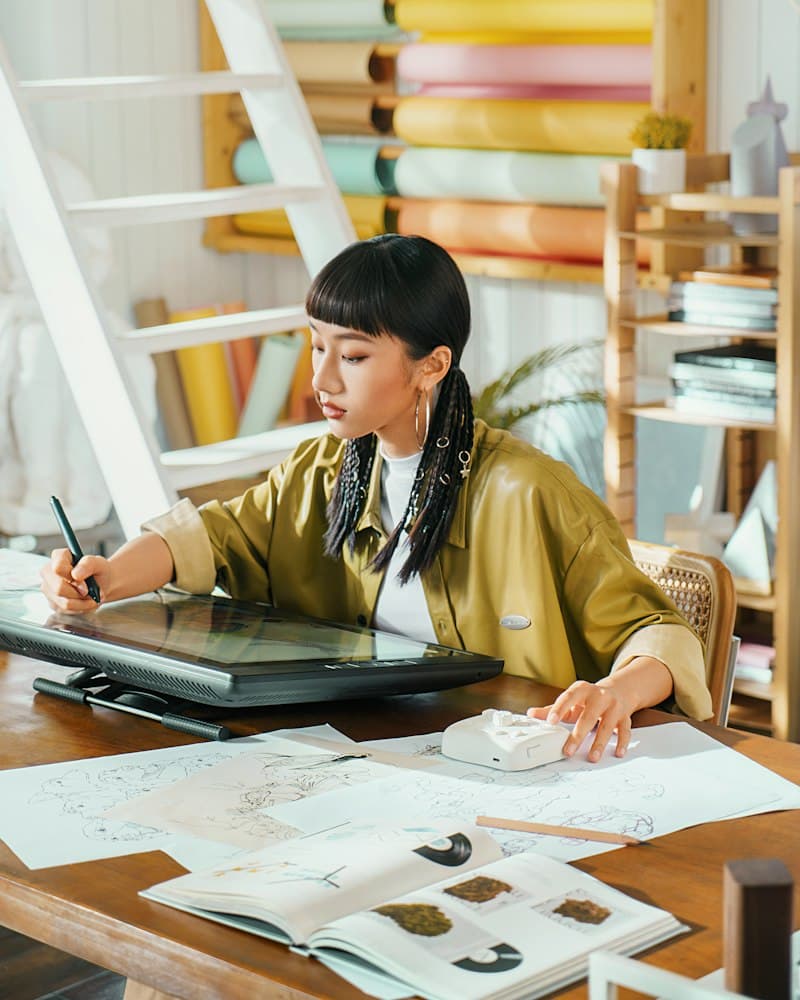 A designer sketching screens at a desk